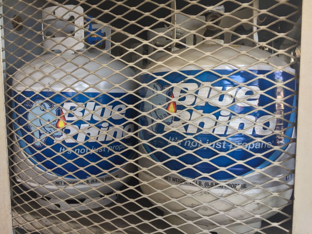 two Blue Rhino Propane Tanks