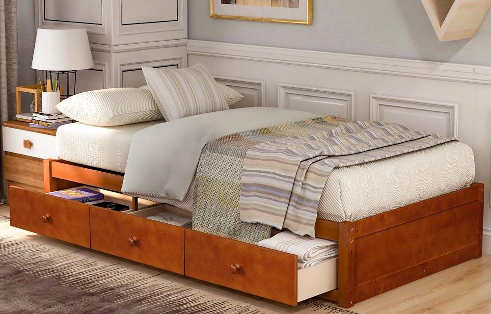 bed with open drawers underneath