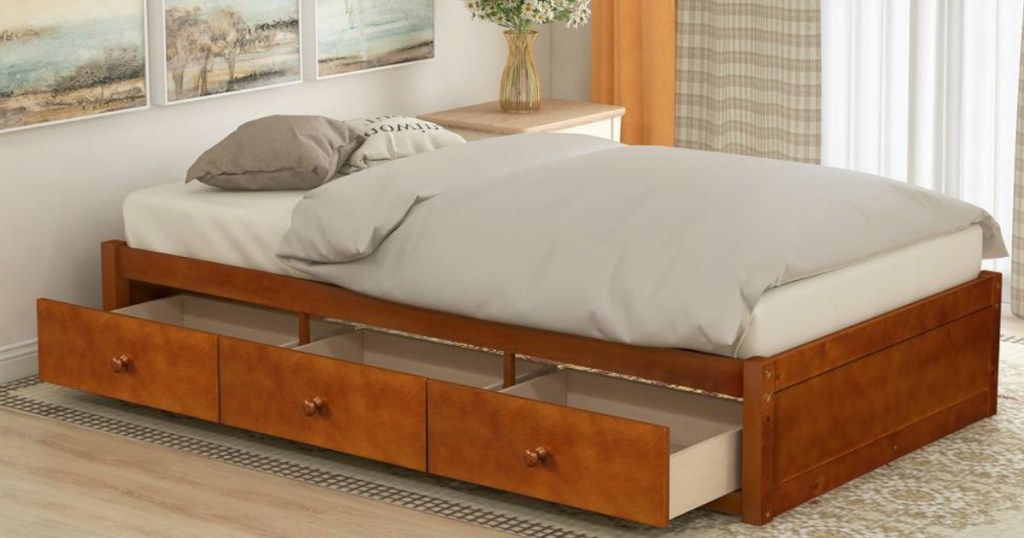 bed with open drawers underneath