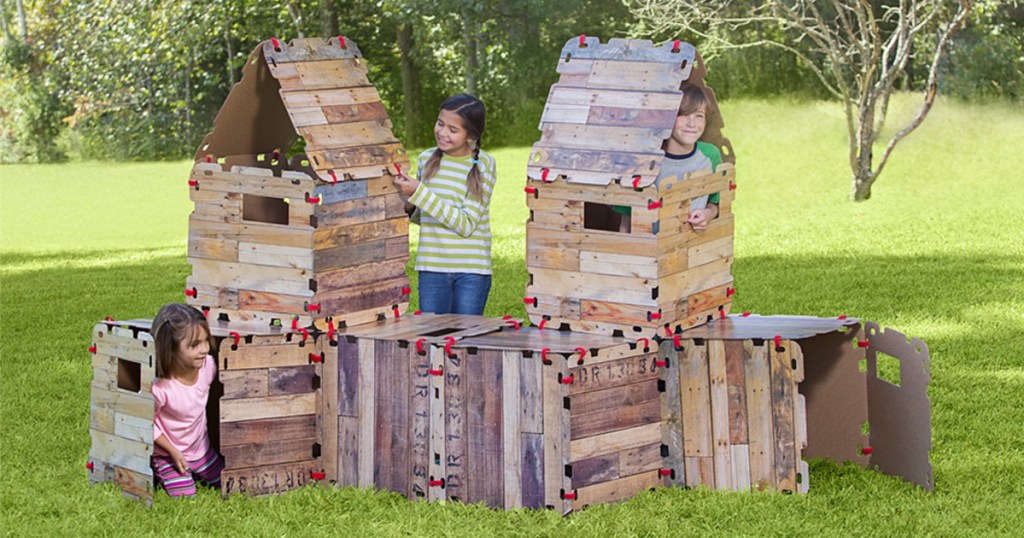 children inside wood play fort outside