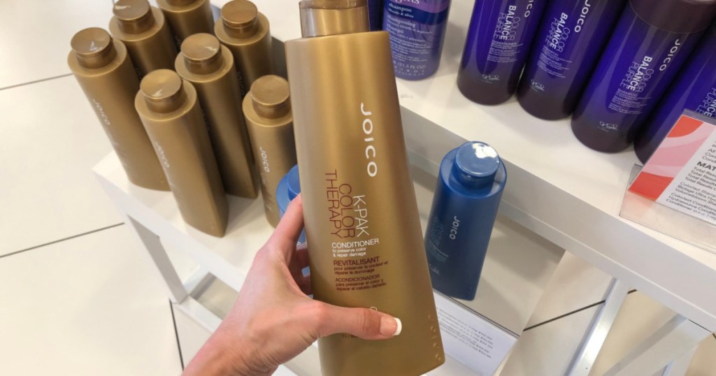 hand holding JOICO K-PAK Conditioner in store