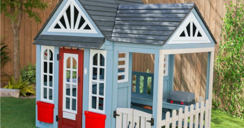 Kidkraft Playhouse shown in yard