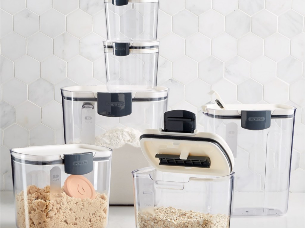 sugar, oats, and flour in storage containers on counter