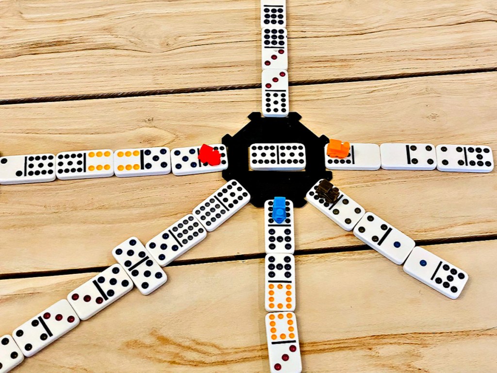 Mexican Train Domino Game in play on wood table