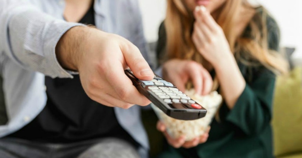 man holding remote control