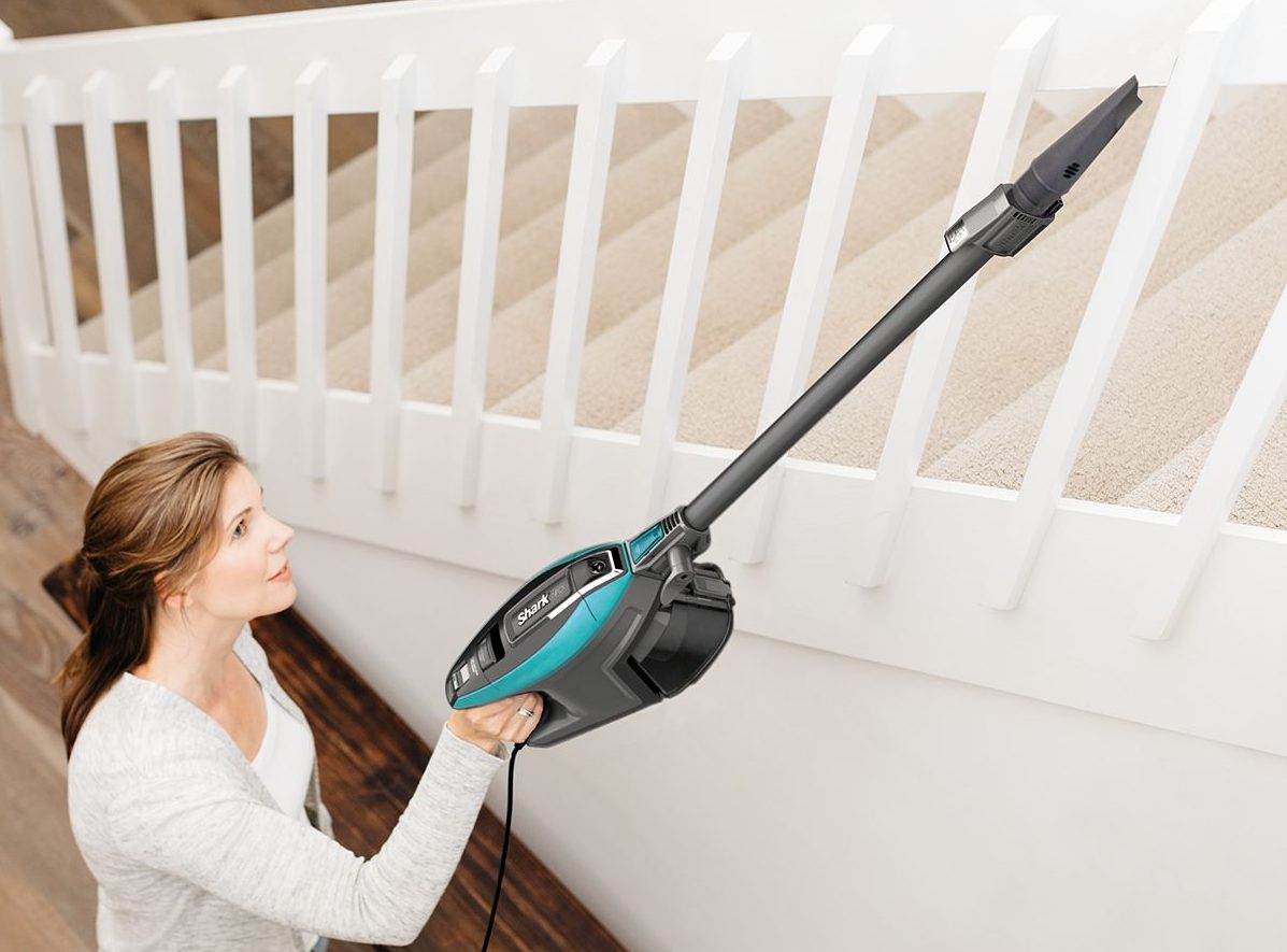 woman vacuuming the stairs