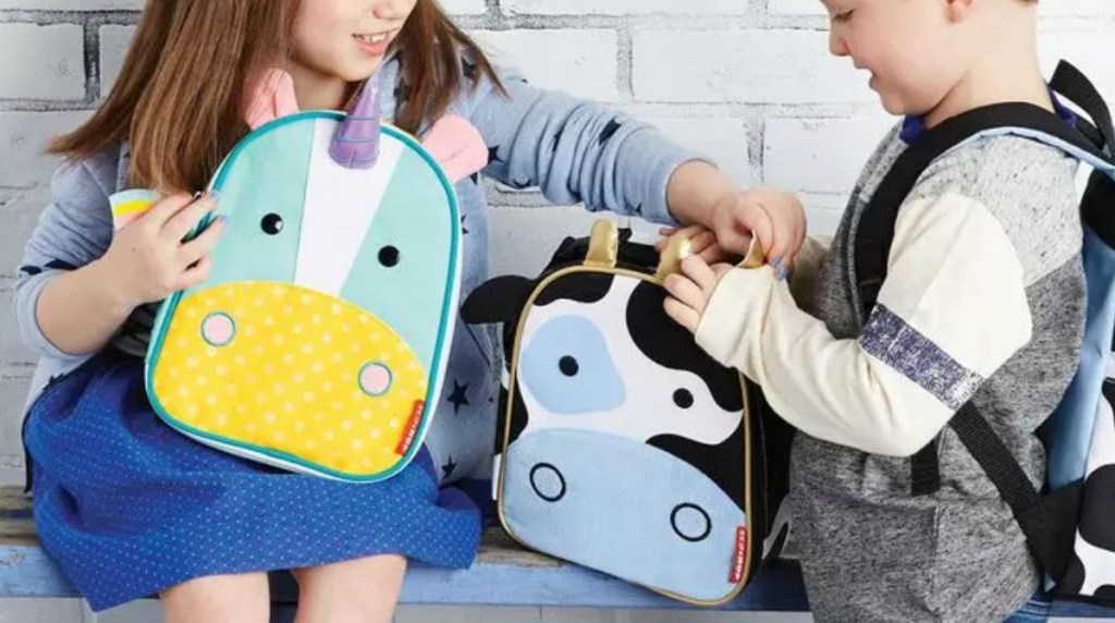 Two kids with zoo animal themed lunchboxes