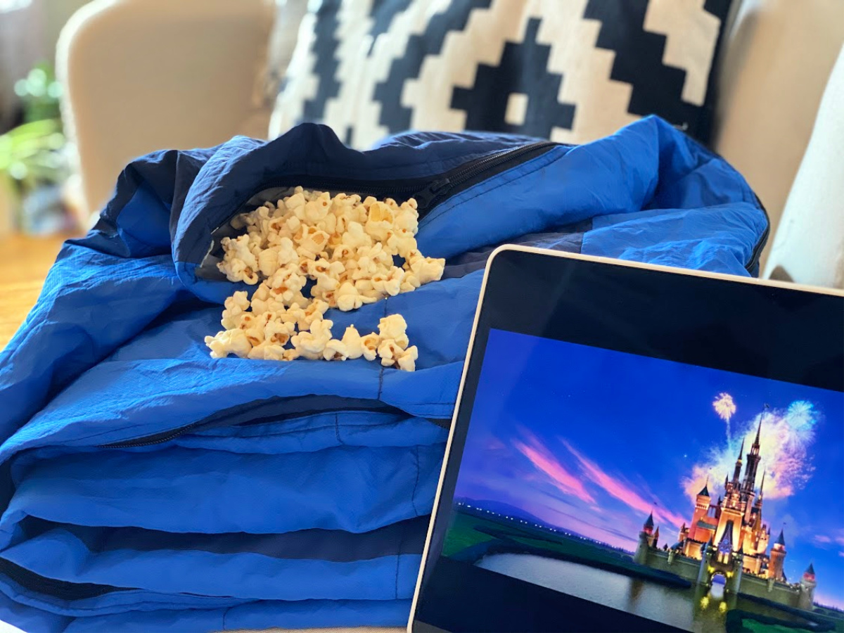 blue-blanket-filled-with-popcorn-and-onlineputer-screen-with-disney-logo