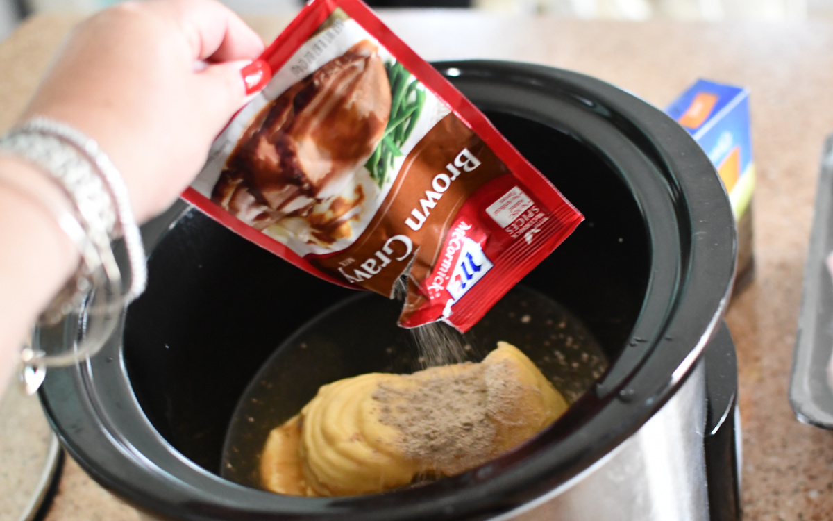 adding packet of brown gravy seasoning to recipe