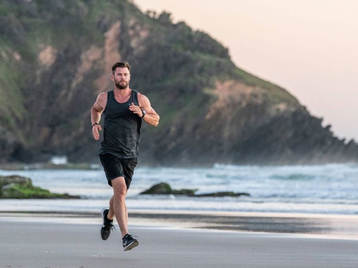 Chris Hemsworth running on beach