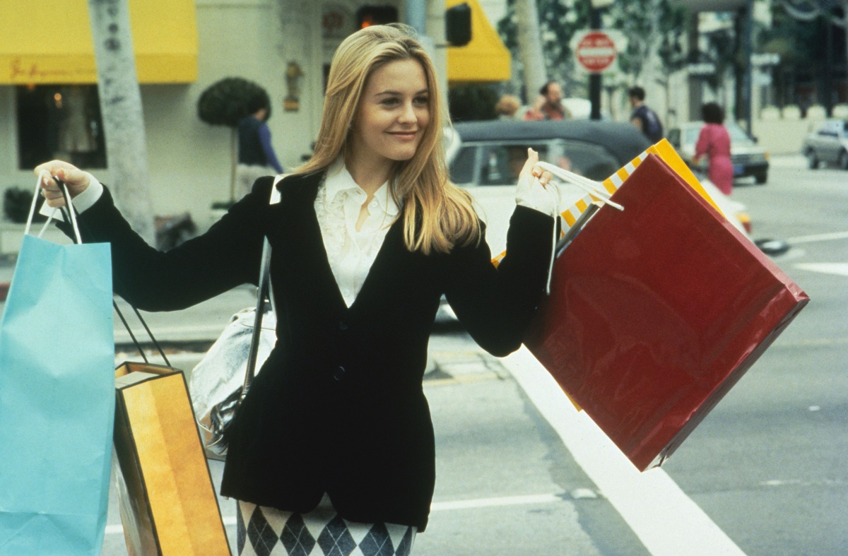 girl in crosswalk with shopping bags