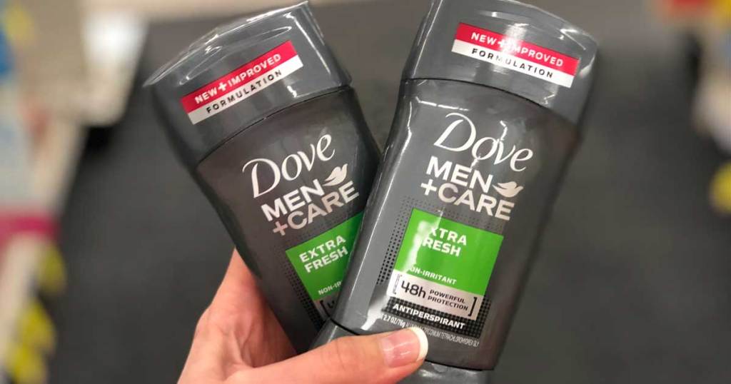 hand holding two dove men deodorants