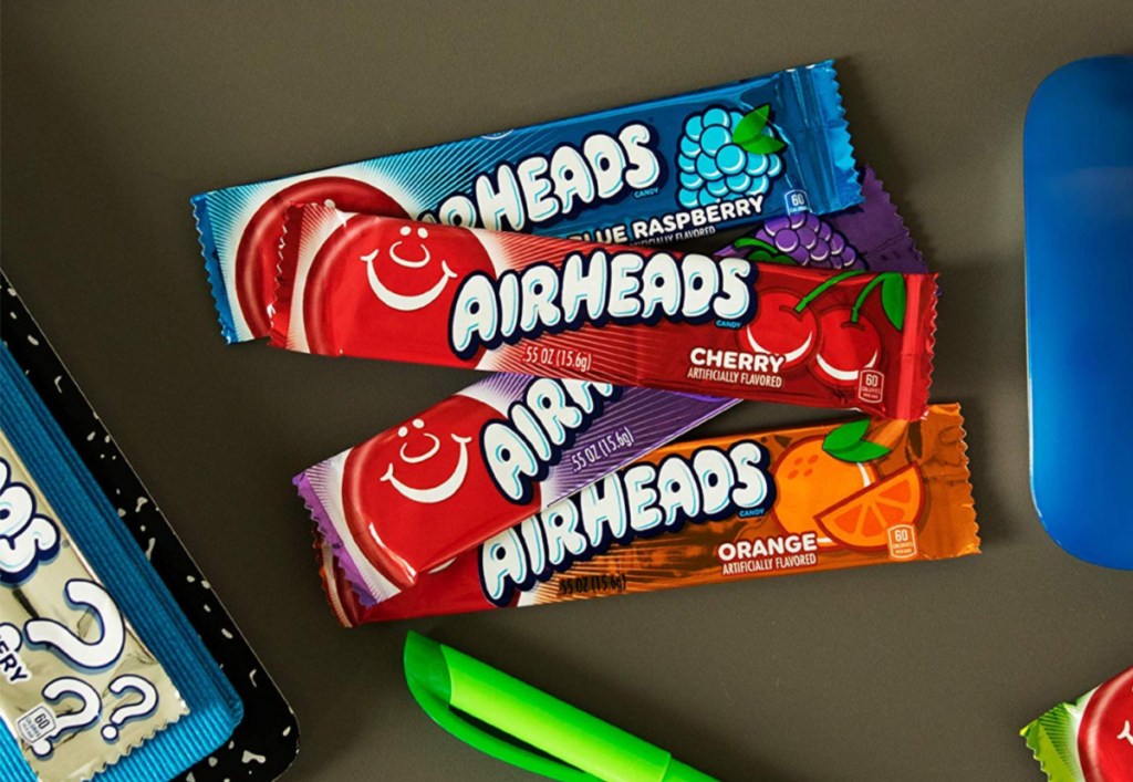 airheads sitting on desk with marker and mouse beside it