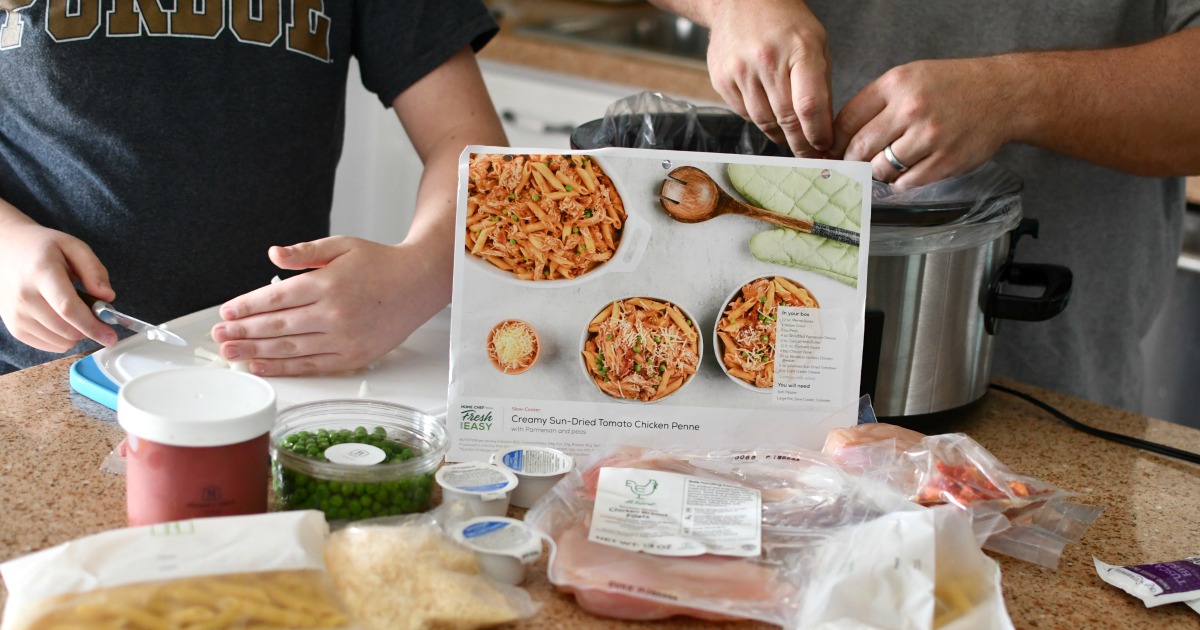 family cooking a home chef meal together