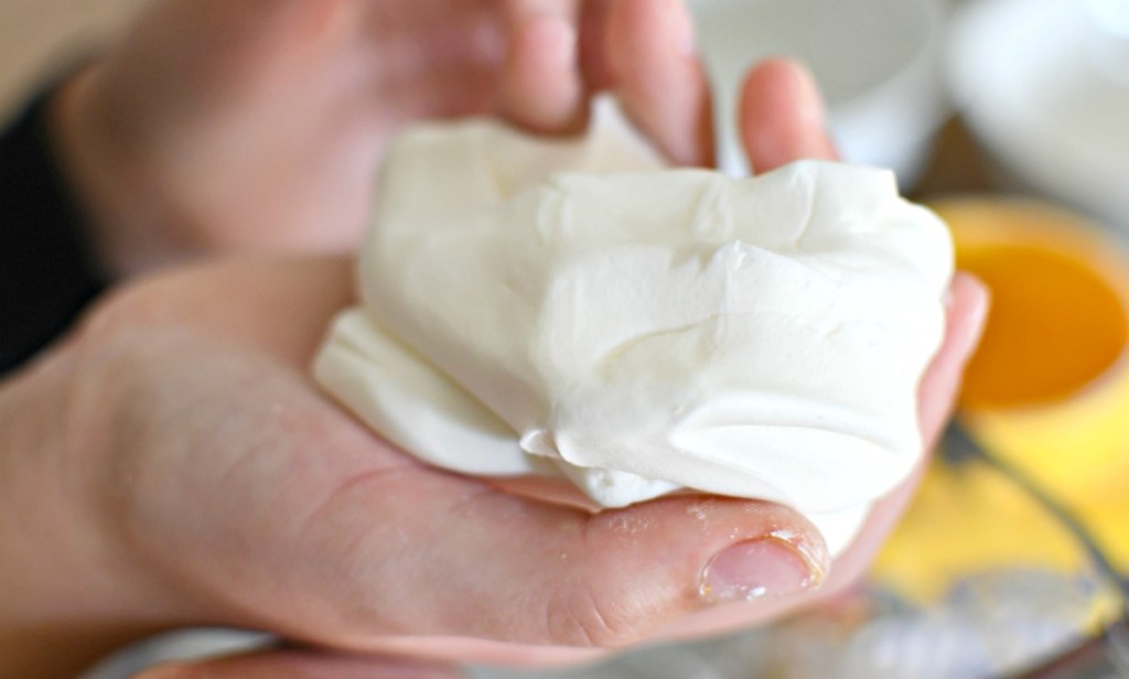 holding white homemade play-dough