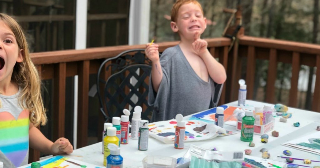 kids painting on outside deck