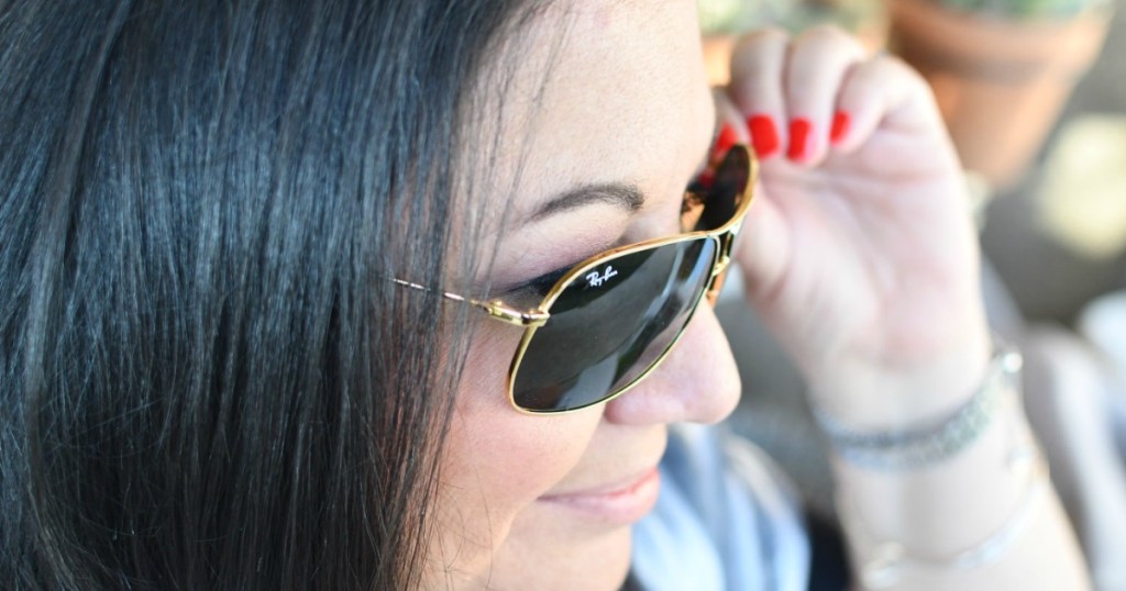 woman wearing stylish pair of sunglasses