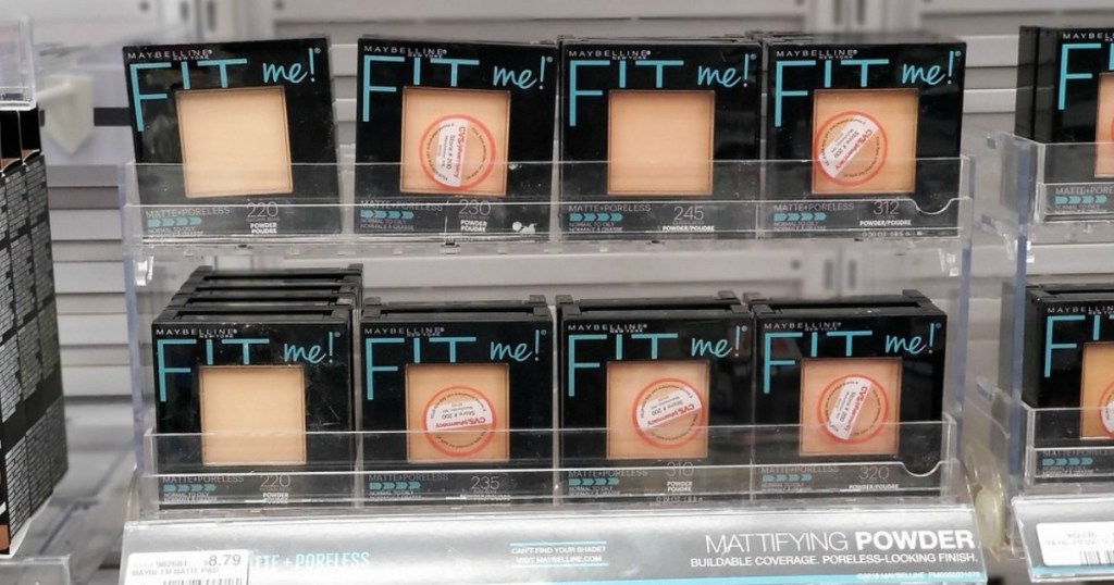 containers of face powder lined up on a store display