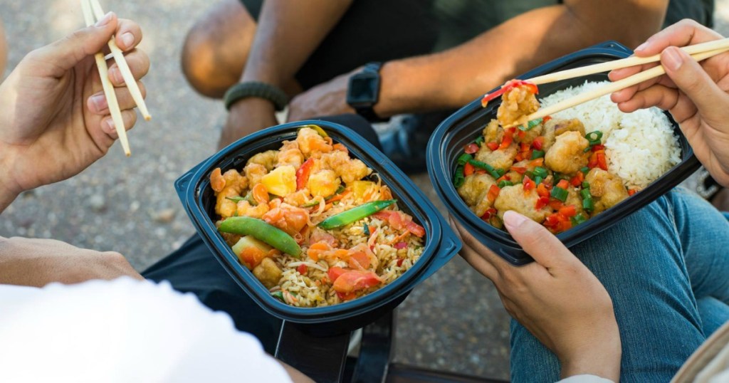 people holding multiple pei wei entrees