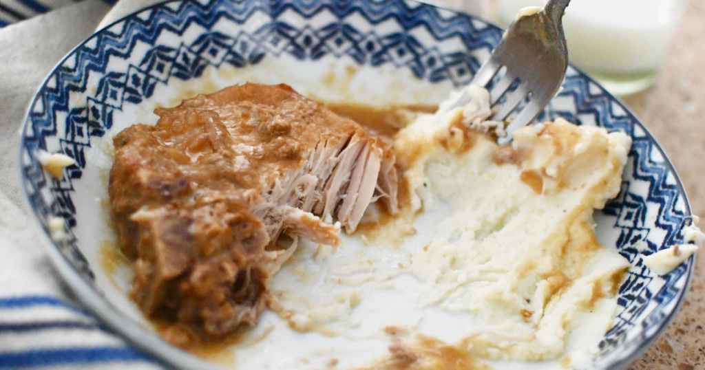 pork chops and potatoes on a plate