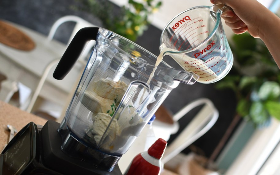 pouring milk in blender