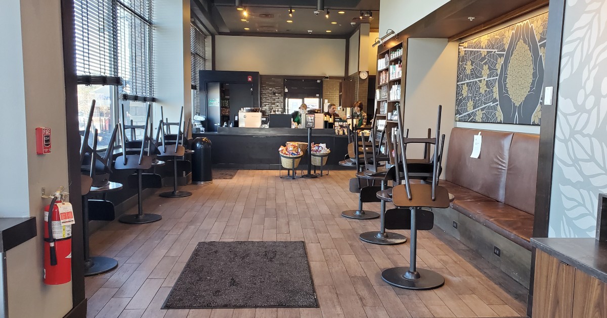 empty Starbucks with chairs stacked