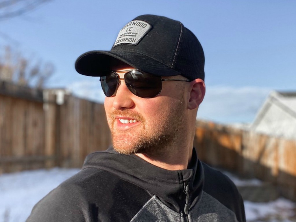 man wearing sunglasses outside by snow