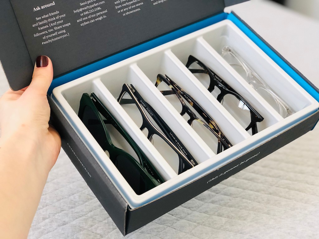 five Warby Parker eyeglasses in try on box 