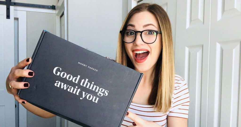 woman holding a box that says good things await you