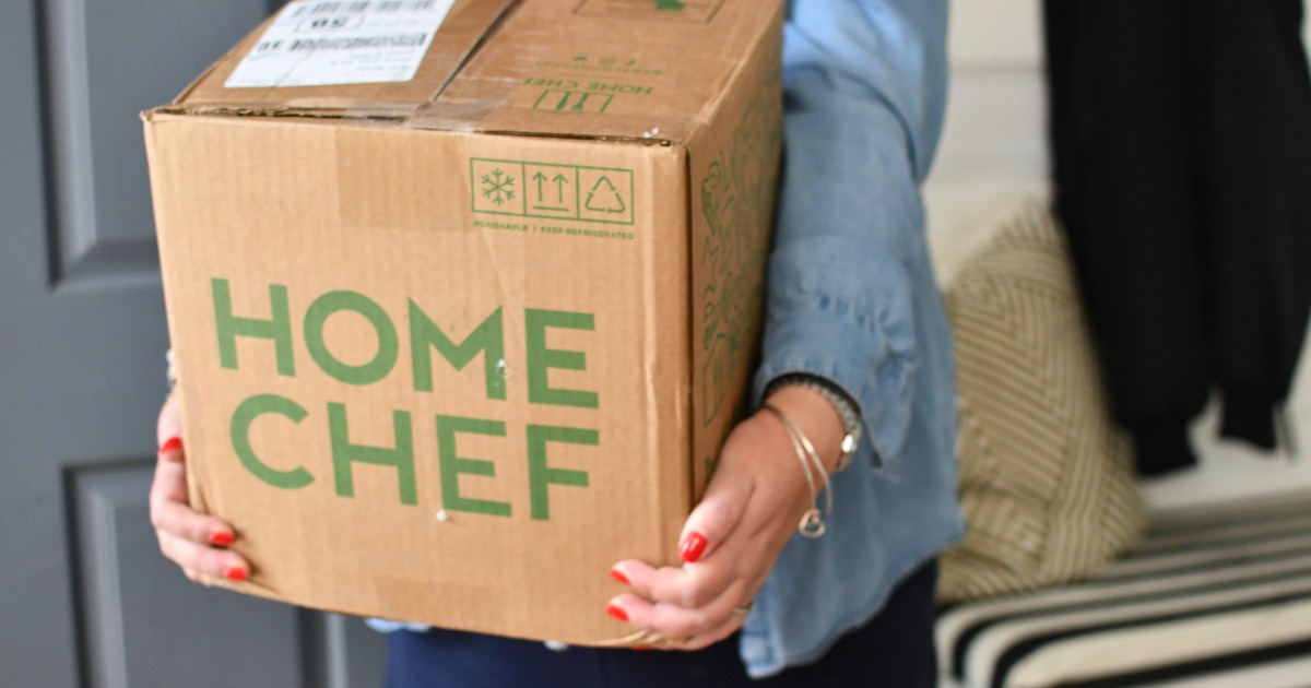 woman carrying home chef box