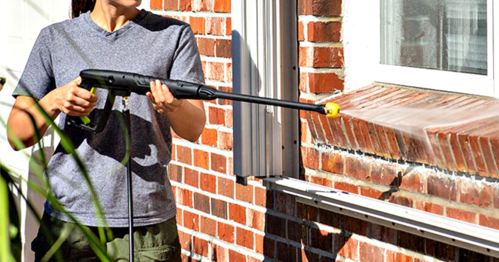 woman using Sun Joe Electric Pressure Washer with Foam Cannon