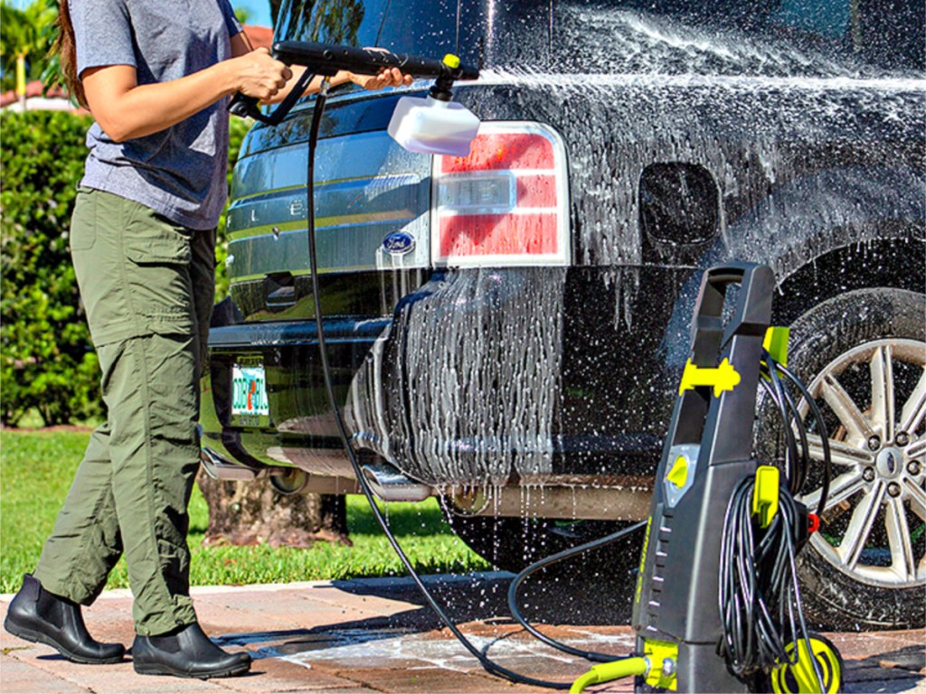 woman washing car with Sun Joe Electric Pressure Washer with Foam Cannon