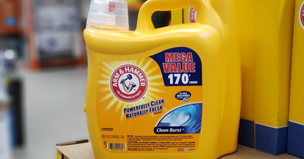 huge yellow bottle of detergent sitting on counter in store