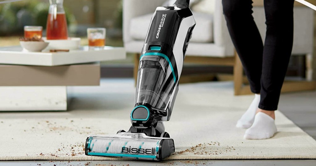 woman pushing a vacuum