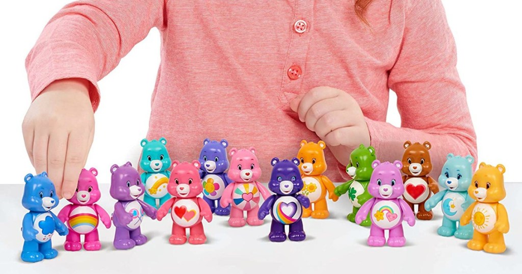 girl playing with Care Bears