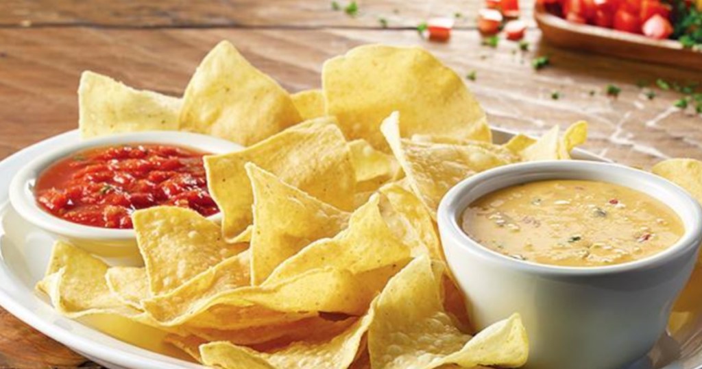 plate with chips, queso, and salsa from cheddars