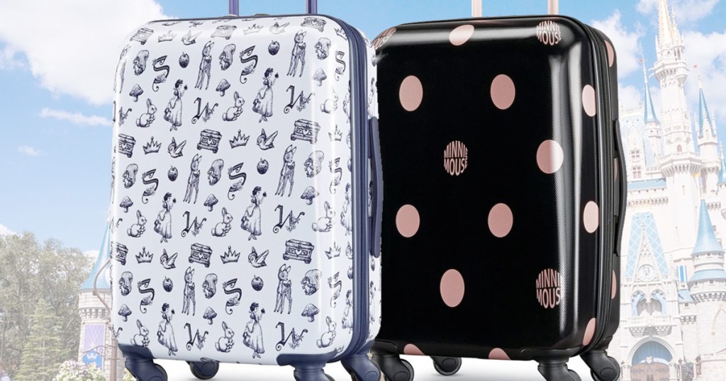 one black and white snow white printed suitcase and one black with rose gold polka dots suitcase