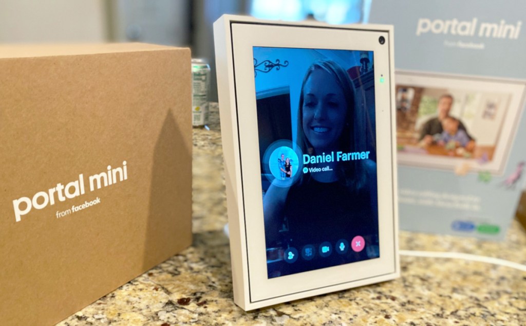 white facebook portal sitting on kitchen counter making a video call