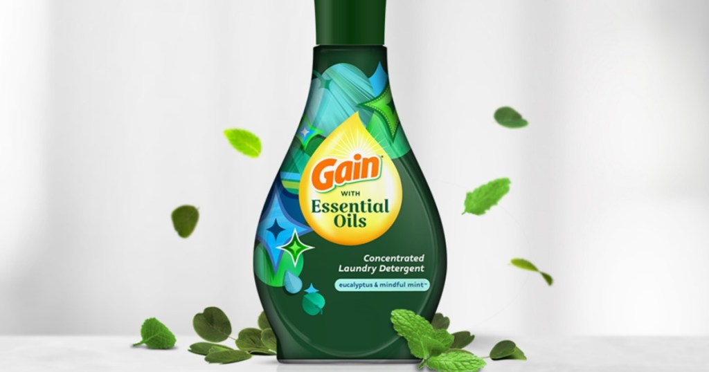 gain laundry detergent surrounded by leaves