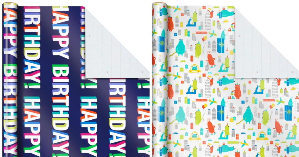 hallmark wrapping paper with navy background with happy birthday writing and also white with monsters