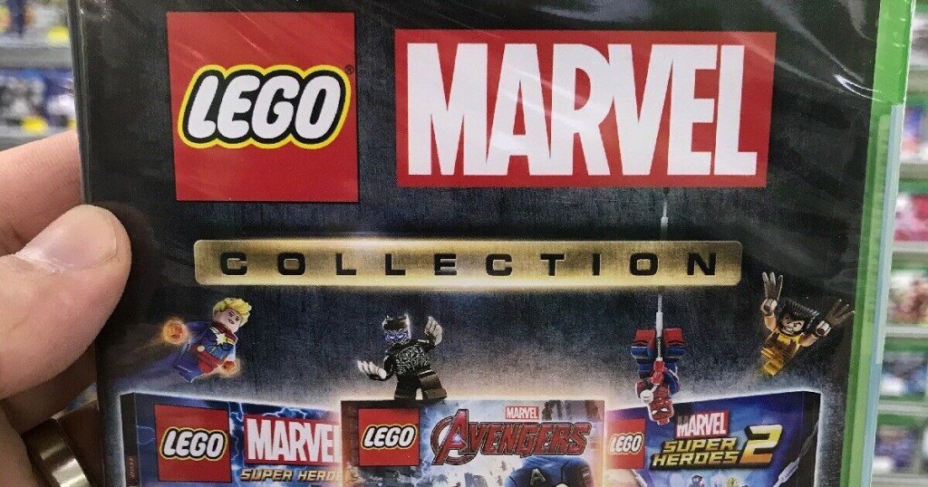 hand holding lego marvel video game in store