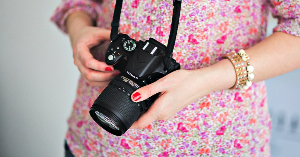 Nikon camera in woman's hands