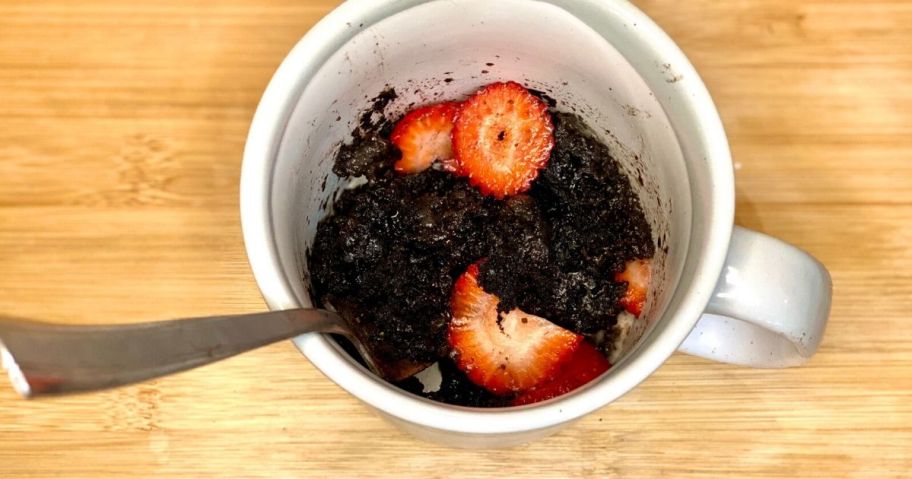 Oreo mug cake topped with strawberries