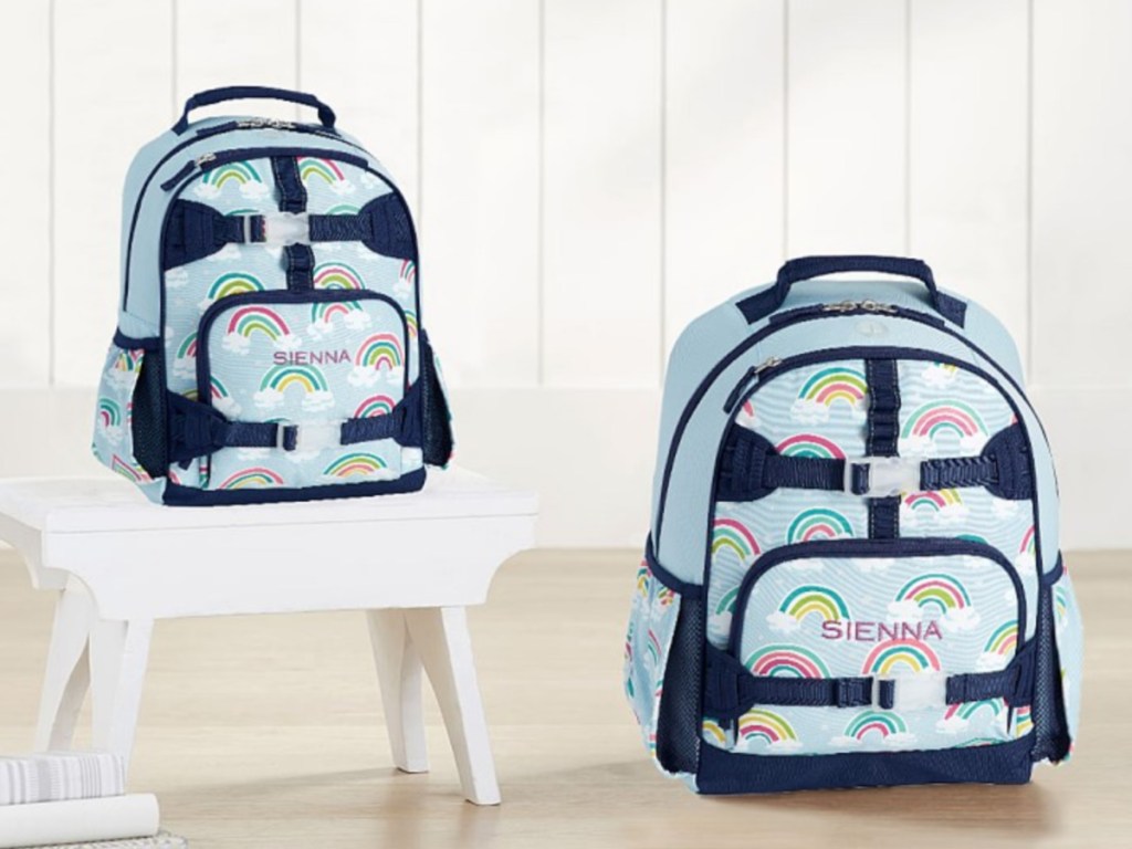 two rainbow backpacks sitting next to each other