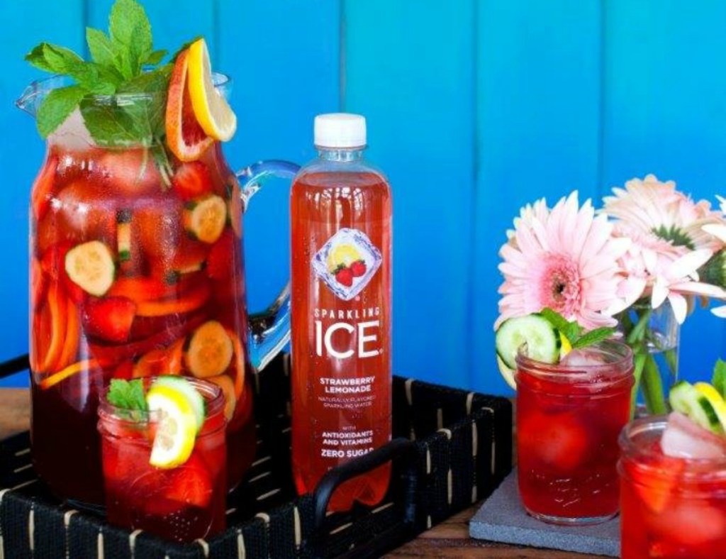 Sparkling Ice strawberry lemonade next to fruit drinks with fruit garnishes