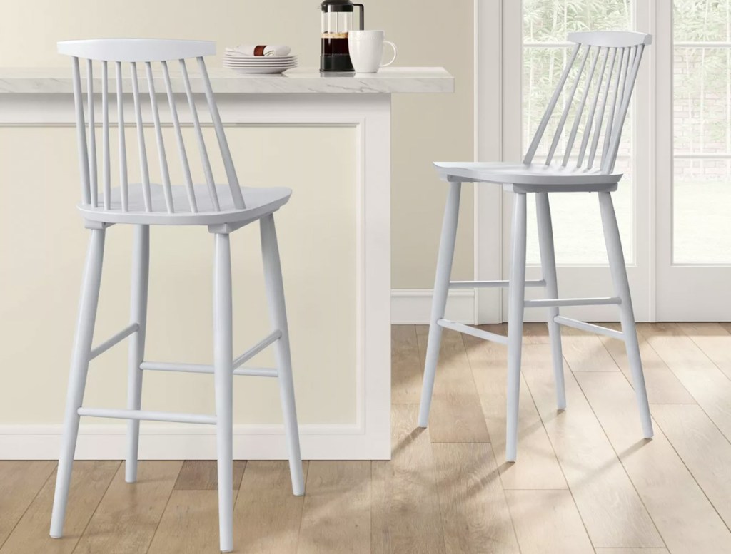 white wooden barstools at breakfast bar in kitchen