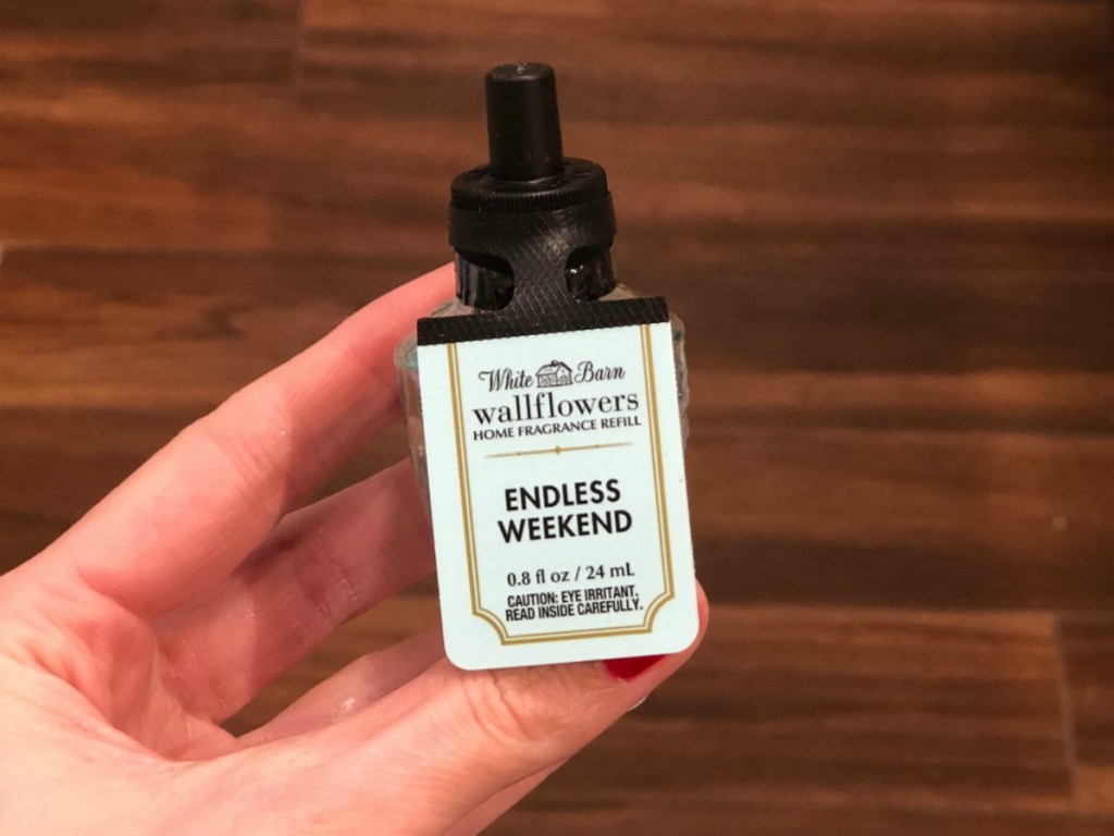 Woman holding White Barn Endless Weekend Wallflowers Fragrance Refill