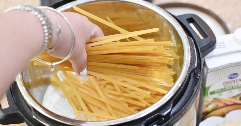 breaking apart noodles and adding to instant pot