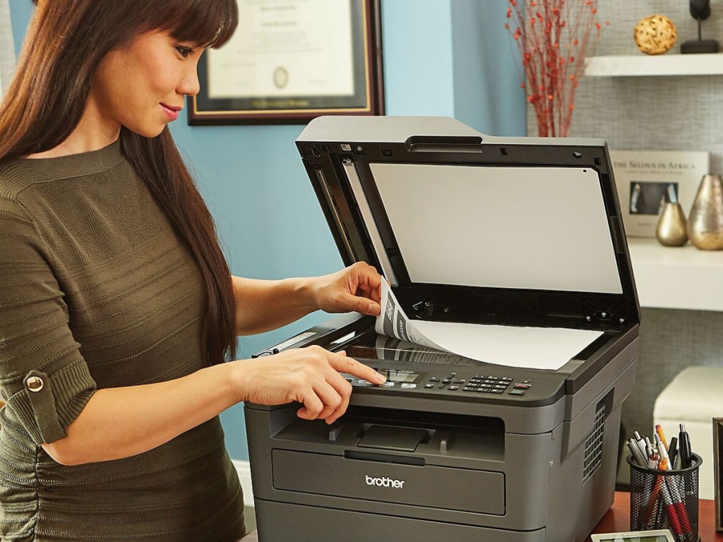 woman using brother printer to fax paper