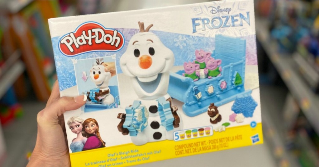 hand holding olaf play-doh set